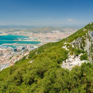 Rock of Gibraltar overlooking city and coastline, representing moving to Gibraltar from UK, Gibraltar residency, living in Gibraltar and relocation planning for UK nationals.
