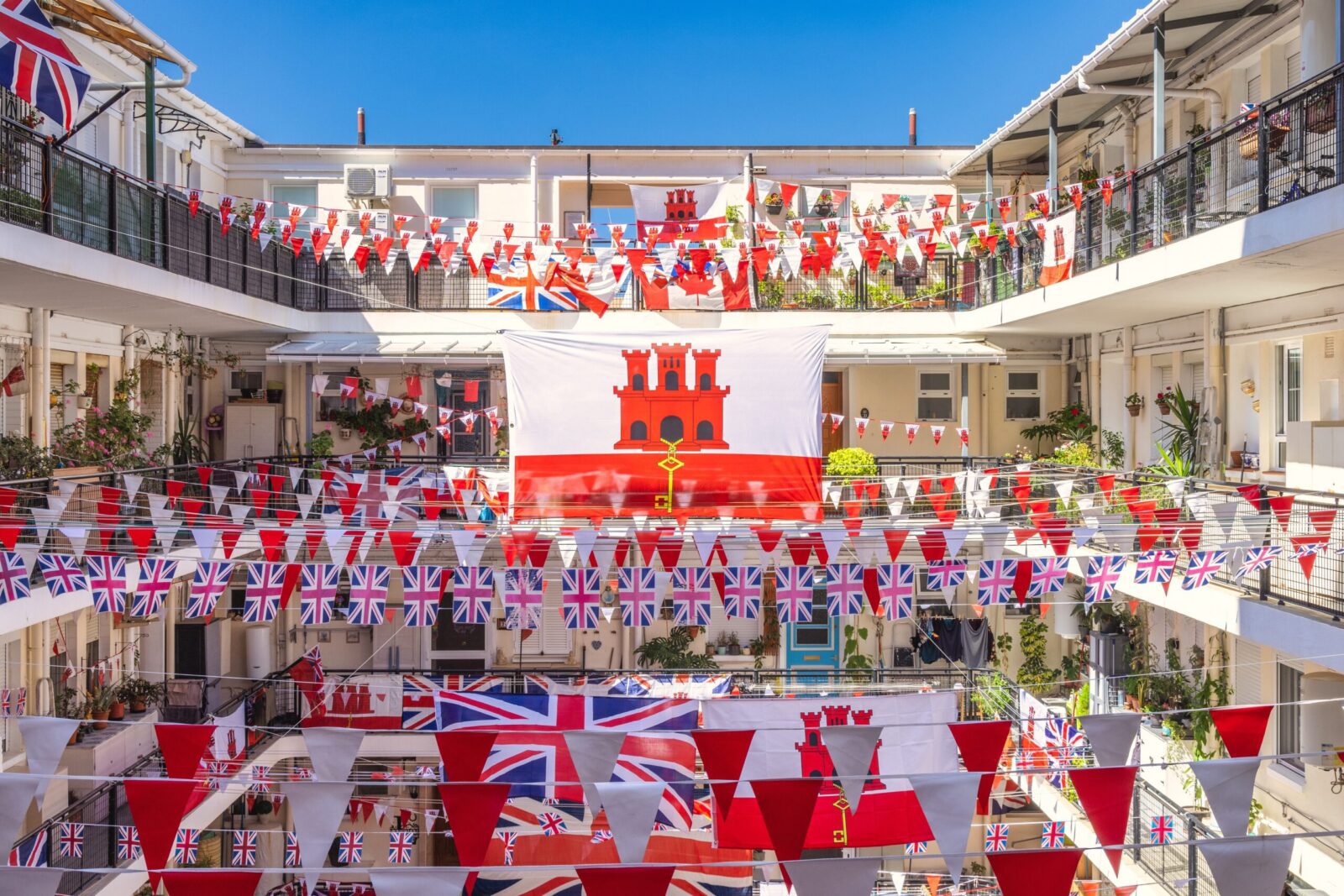 British and Gibraltar flags decorating a residential community, reflecting everyday life and safety in Gibraltar.
