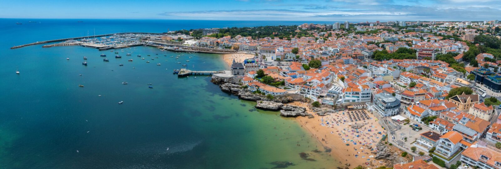 Cascais coastal town with marina and beaches, representing moving to Portugal from UK, Cascais lifestyle, UK expats, luxury coastal living and Portugal retirement.