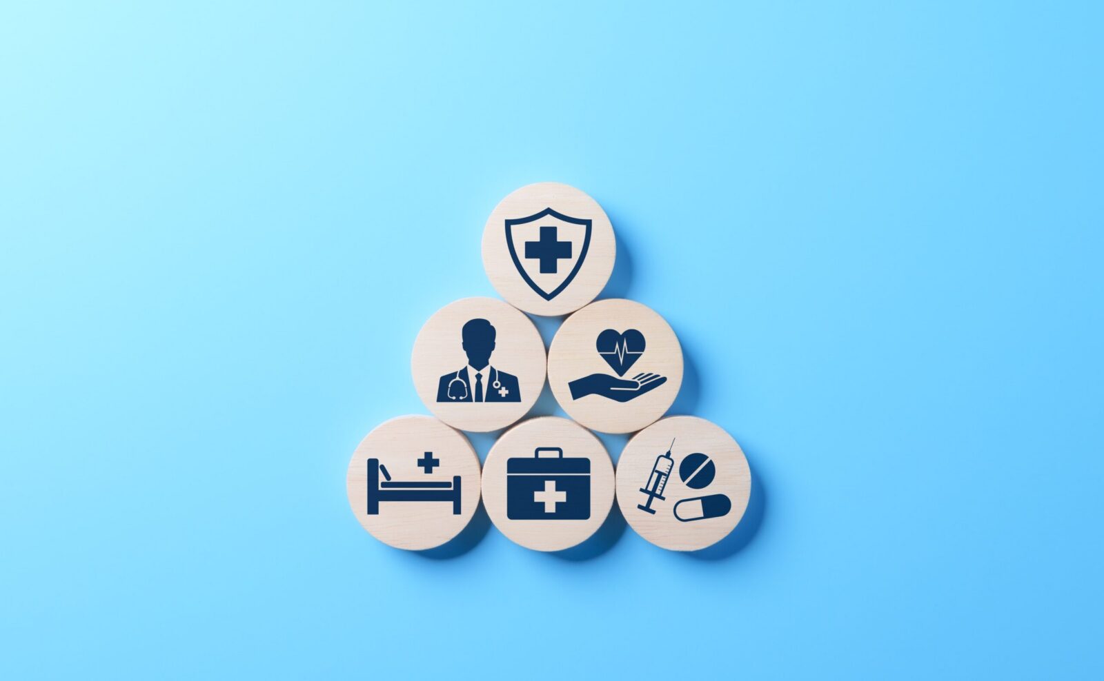Healthcare and medical insurance symbols representing hospital care, doctors, treatment and medication.